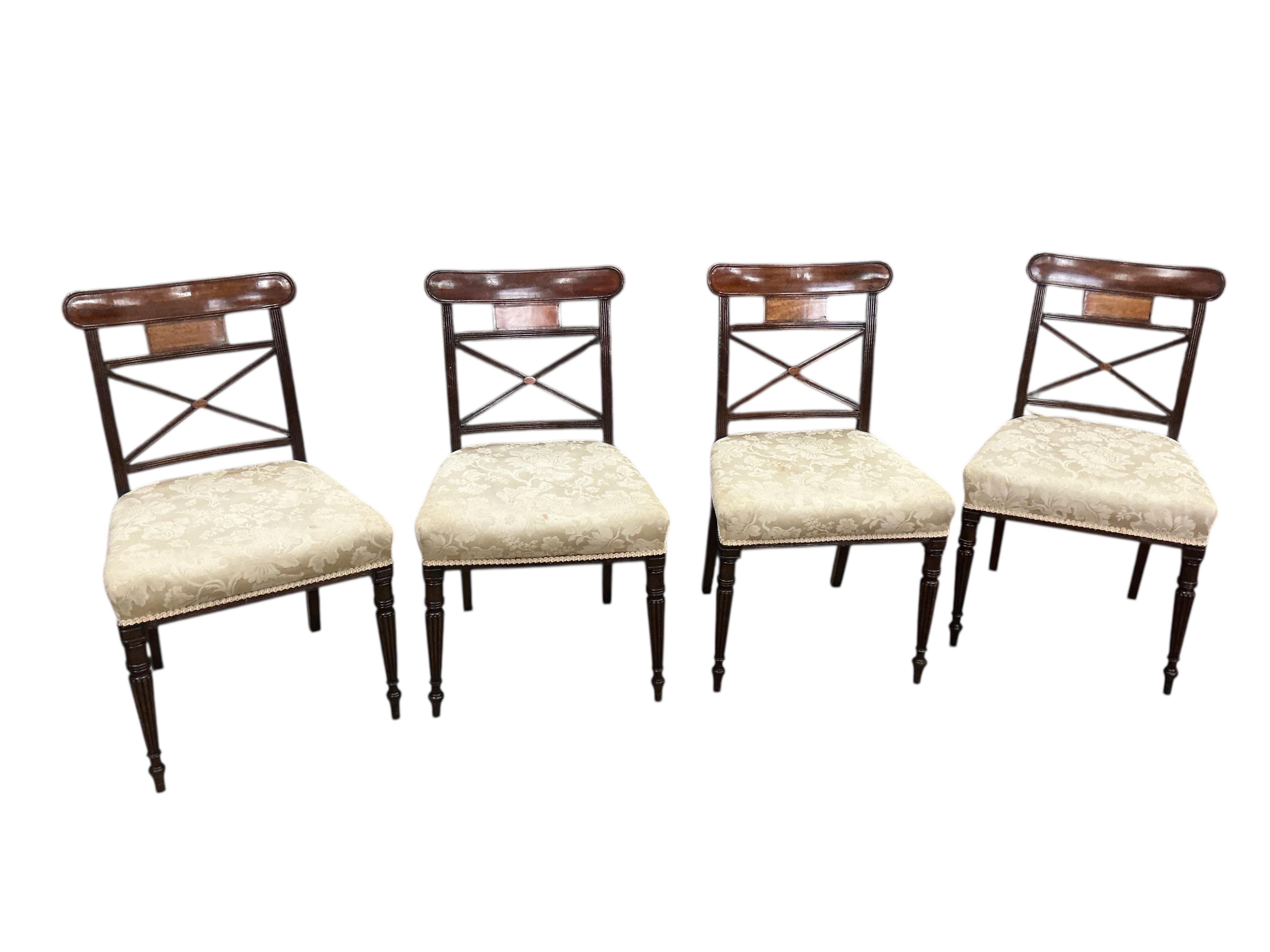 A set of eight Regency mahogany dining chairs, one with arms